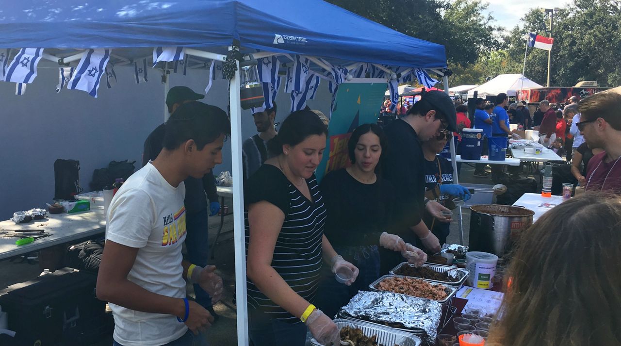 People gather at a tent serving kosher BBQ meat during the 7th Annual Texas Kosher BBQ Championship on San Antonio's North Side November 10, 2019 (Spectrum News)