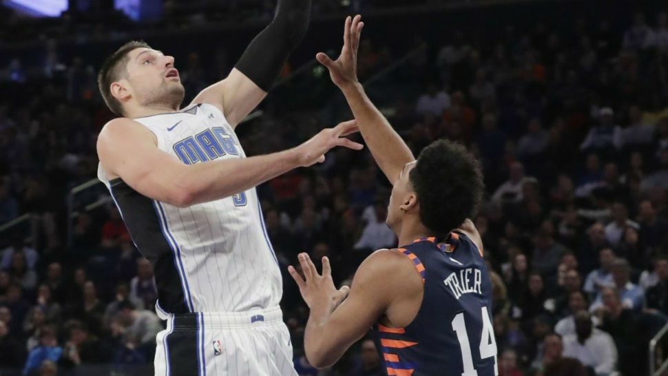 Orlando Magic's Nikola Vucevic, left, drives past New York Knicks' Allonzo Trier, right, during the first half of an NBA basketball game Sunday, Nov. 11, 2018, in New York. (AP Photo/Frank Franklin II)