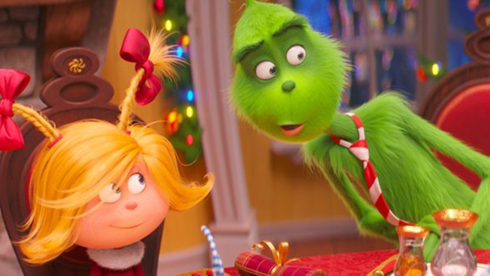 The characters of Cindy-Lou Who, voiced by Cameron Seely, and Grinch, voiced by Benedict Cumberbatch, in a scene from "The Grinch." (Courtesy of Universal Pictures)