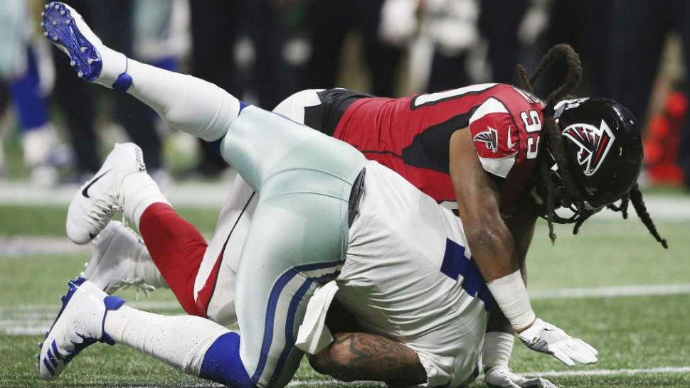 Atlanta Falcons defensive end Adrian Clayborn (99) sacks Dallas Cowboys quarterback Zac Dysert (4) during the second half of an NFL football game, Sunday, Nov. 12, 2017, in Atlanta. (David Goldman/AP)