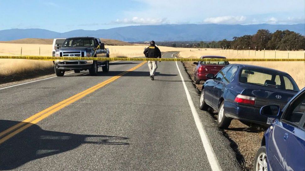 Crime tape blocks off Rancho Tehama Road leading into the Rancho Tehama subdivision south of Red Bluff, Calif., following a fatal shooting on Tuesday, Nov. 14, 2017. (Jim Schultz/The Record Searchlight via AP)