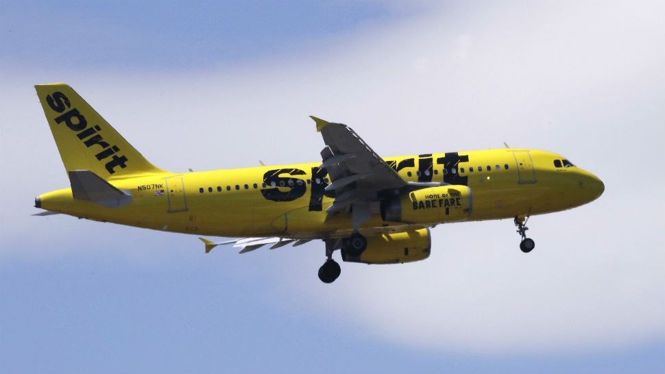 A Spirit Airlines passenger jet plane, an Airbus 319 model, approaches Logan Airport in Boston, Thursday, May 24, 2018. (AP Photo/Charles Krupa)