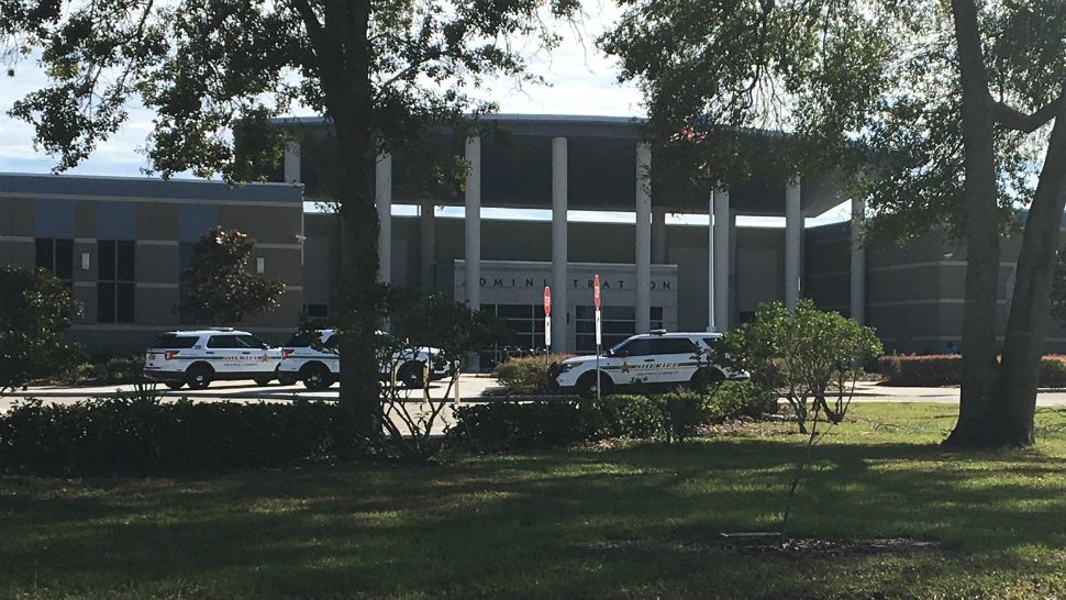 Orange County Sheriff's deputies assist school district security in a sweep of Wekiva High School on Thursday morning after a school resource officer responded to a report of an armed student. (Derrick King/Spectrum News 13)