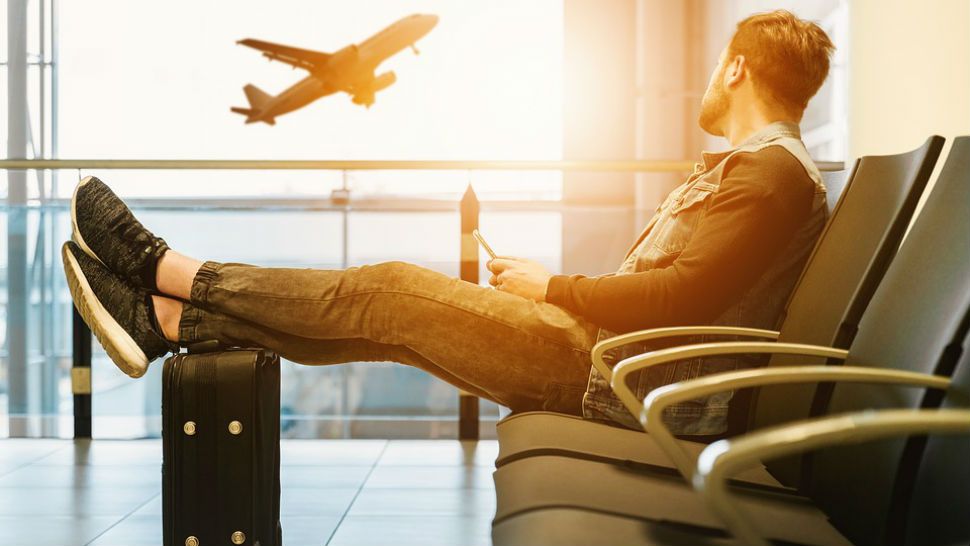 FILE photo of traveler lounging at a terminal before his flight. (Pixabay)