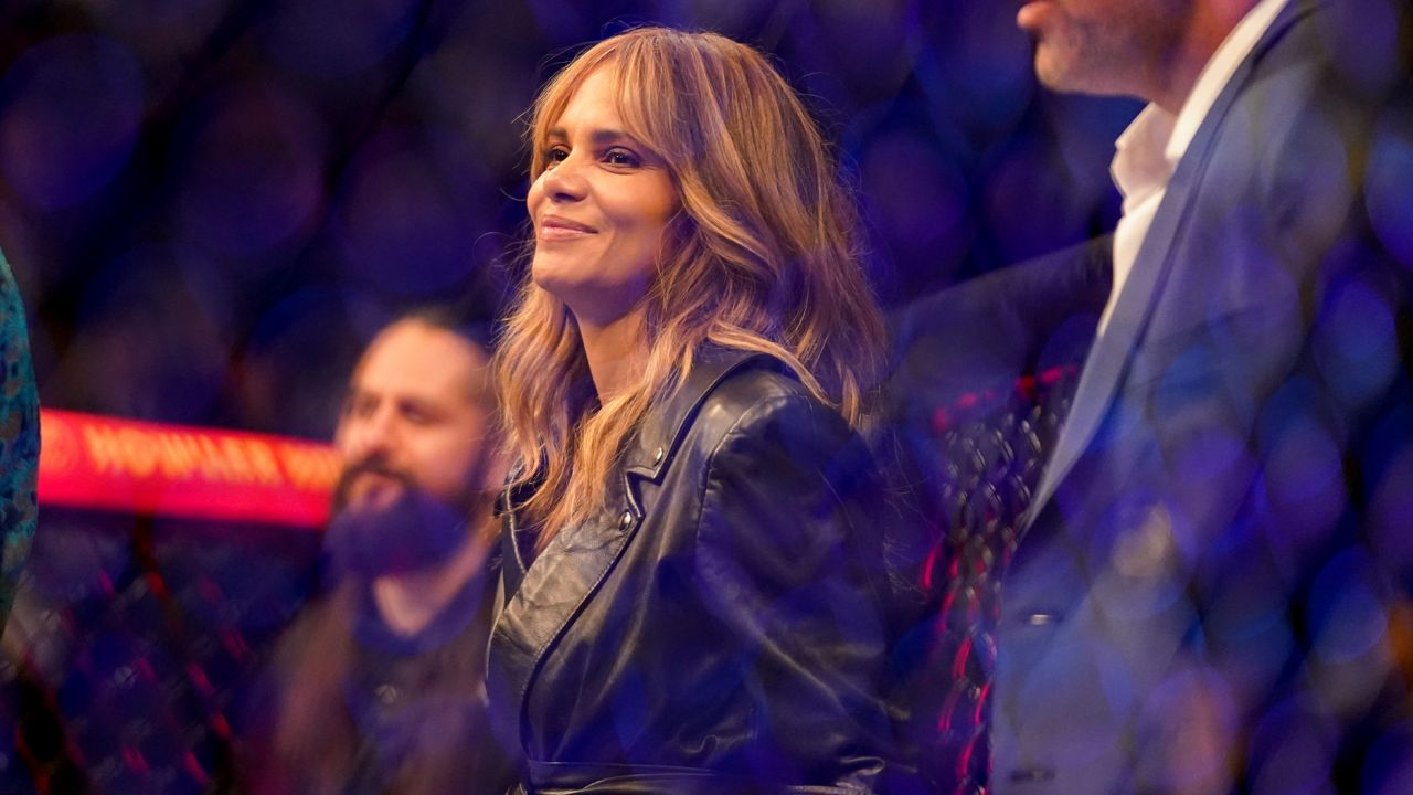 Halle Berry stands inside the octagon before a welterweight mixed martial arts championship bout between Kamaru Usman and Colby Covington at UFC 268, Sunday, Nov. 7, 2021, in New York. (AP Photo/Corey Sipkin)