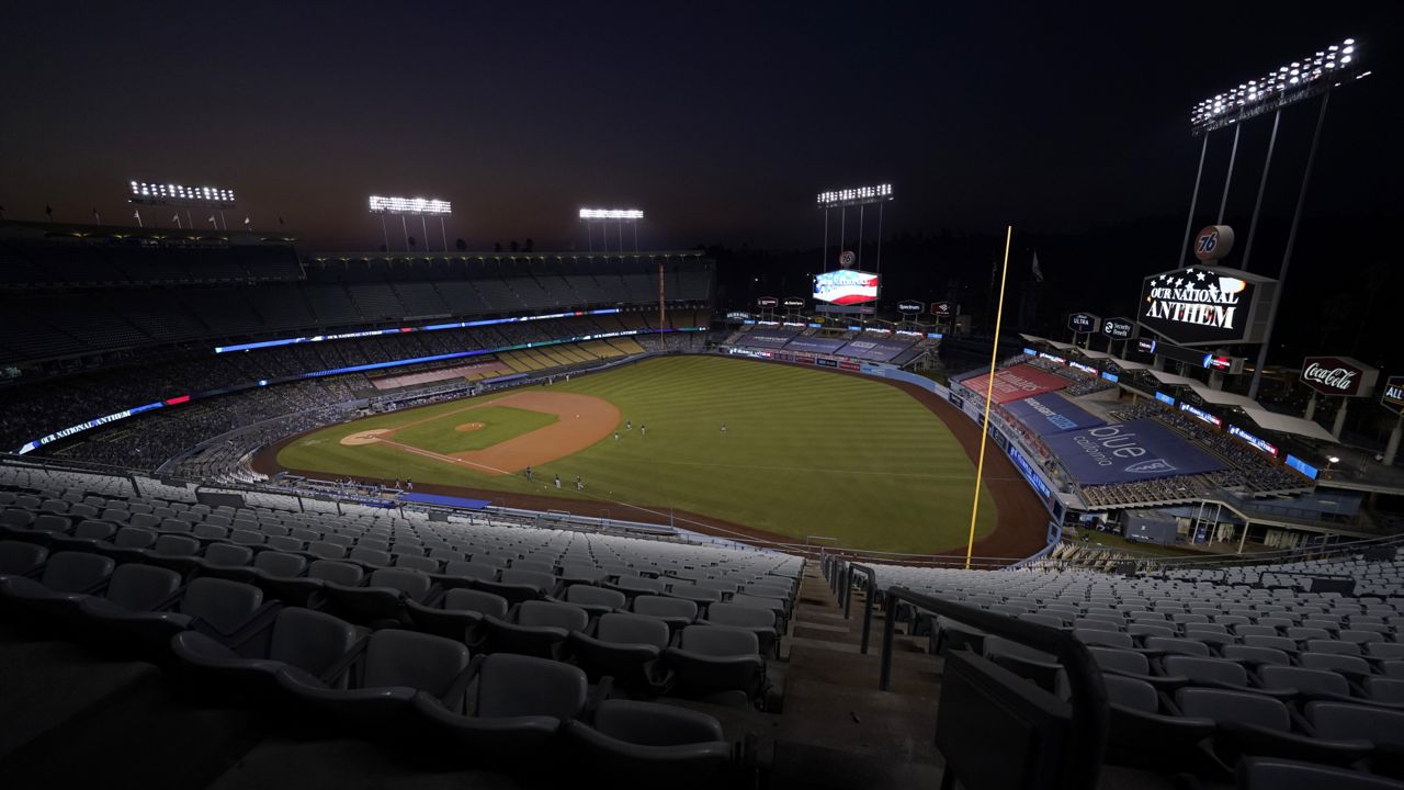 Dodger Stadium is seen without fans as the Los Angeles Dodgers prepare to play the Milwaukee Brewers in Game 2 of a National League wild-card baseball series Thursday, Oct. 1, 2020, in Los Angeles. (AP Photo/Ashley Landis)