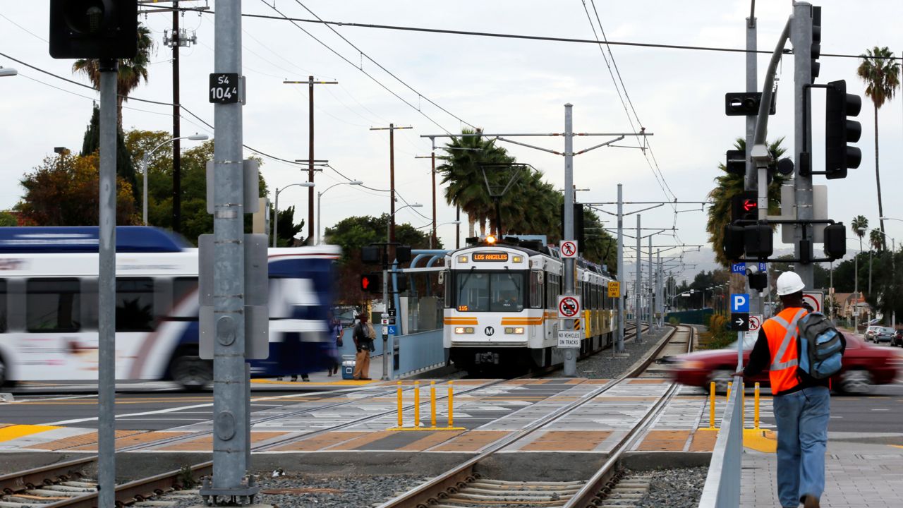 An MTA Expo Line train at the Expo/Crenshaw station, at Exposition and Crenshaw Boulevards, in Los Angeles' Crenshaw district Tuesday, Jan. 21, 2014. (AP Photo/Reed Saxon)