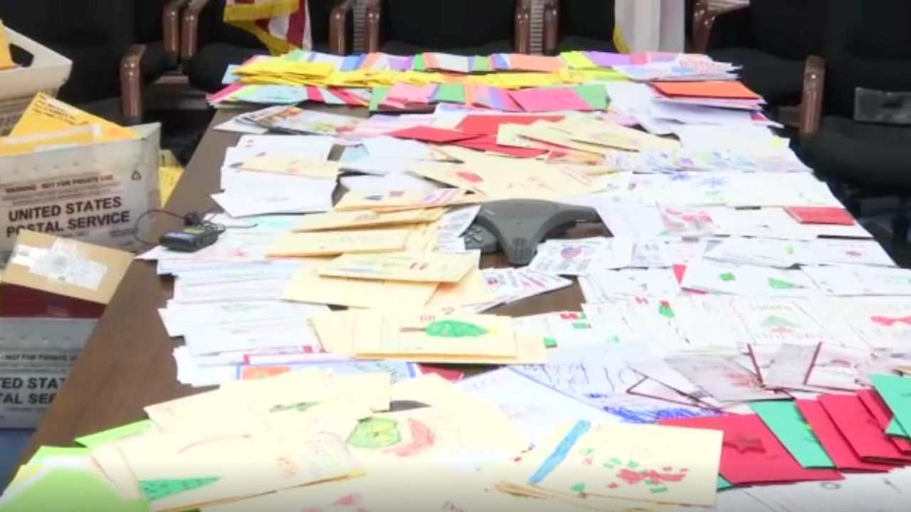 A generic image of piles of letters and mail stacked on top of a long table (Spectrum News/File)