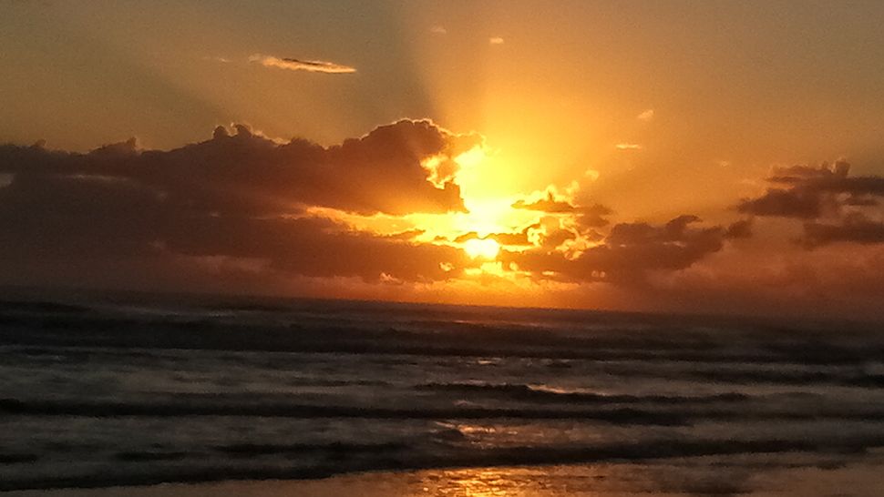Submitted via the Spectrum News 13 app: Sunrise in New Smyrna Beach, Sunday, Nov. 18, 2018. (Courtesy of Kim Kisellus)
