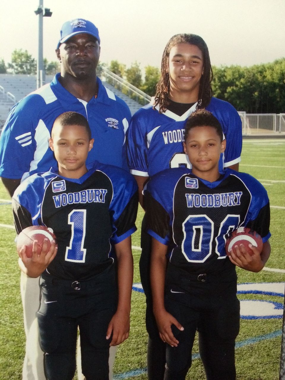 The Green family pose for a football photo when the twins were in grade school. (Courtesy: The Green family)