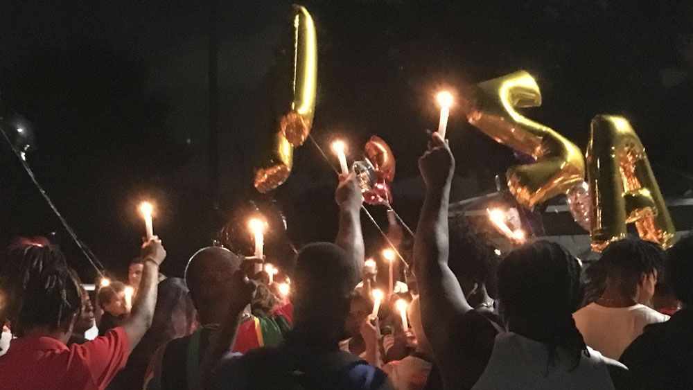 Around 100 people showed up for the vigil for Xavier Greene at Winston Park. (Laurie Davison, Spectrum News)