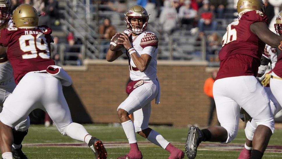 Florida State quarterback Jordan Travis (13) looks to pass during the first half of an NCAA college football game against Boston College, Saturday, Nov. 20, 2021, in Boston. (AP Photo/Mary Schwalm)