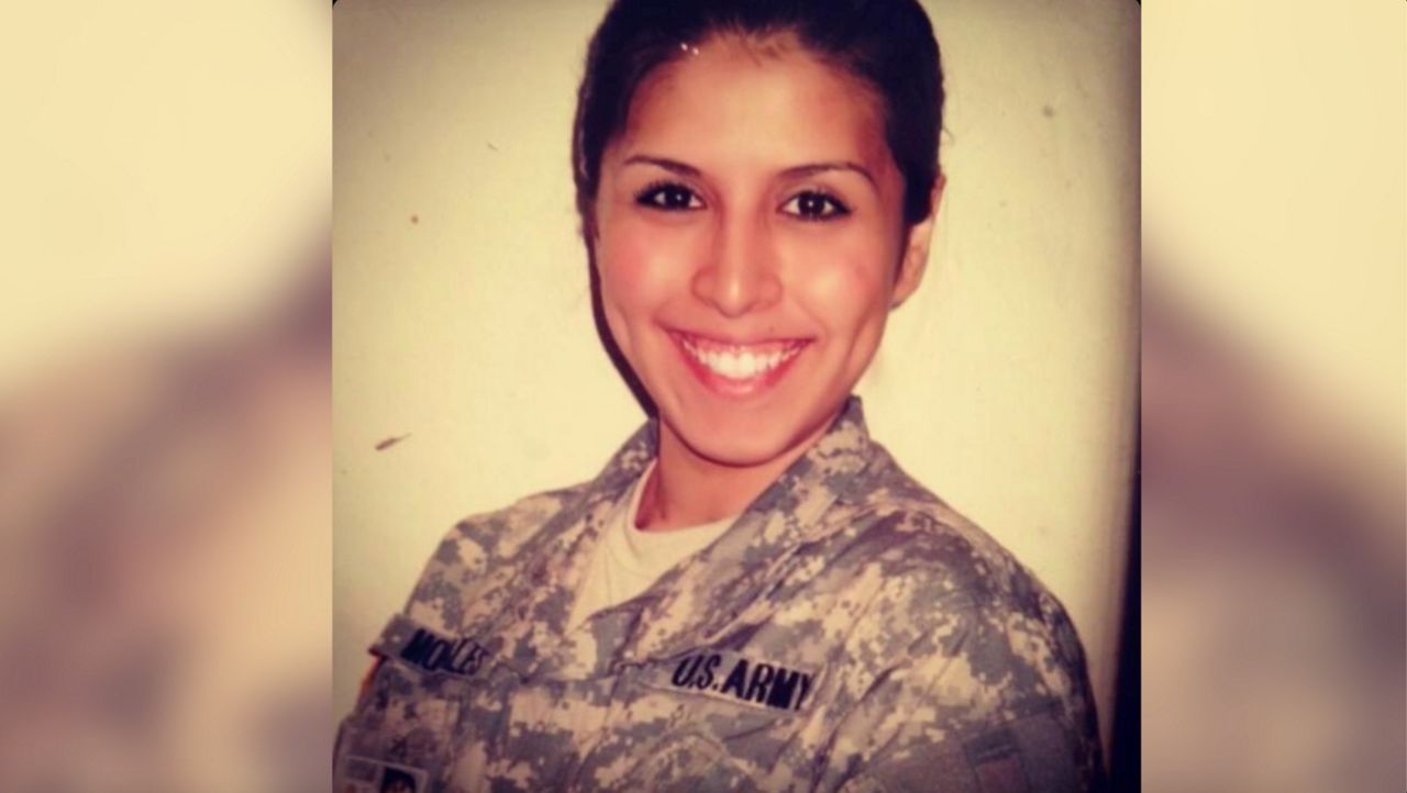 Army veteran Laura Porras takes a photo in her military uniform. (Courtesy: Laura Porras)