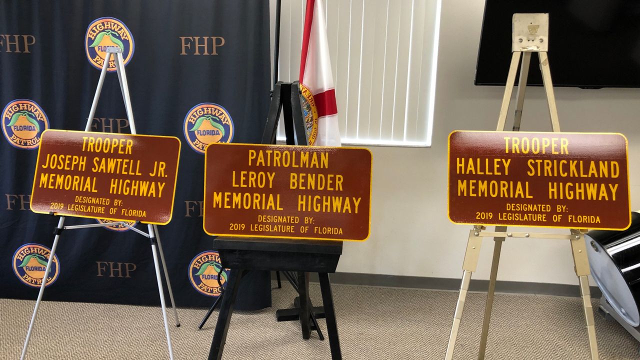 Three Florida Highway Patrol troopers who were killed in traffic accidents were honored with roadway dedications. (Jon Shaban/Spectrum News)