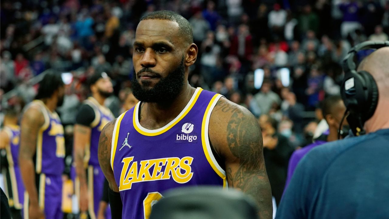 Los Angeles Lakers forward LeBron James is ejected after fouling Detroit Pistons center Isaiah Stewart during the second half of an NBA basketball game, Sunday, Nov. 21, 2021, in Detroit. (AP Photo/Carlos Osorio)