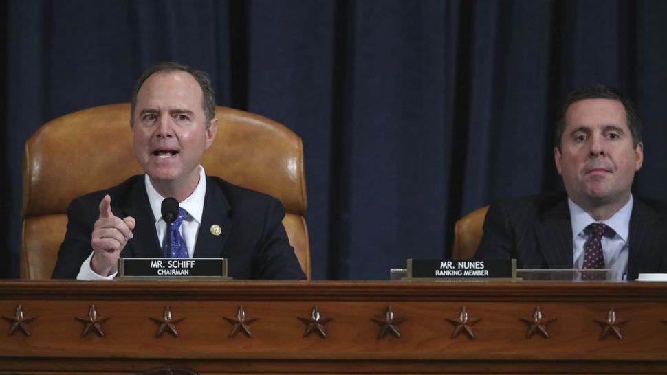 House Intelligence Committee Chairman Adam Schiff, D-Calif., left, with Rep. Devin Nunes, R-Calif, the ranking member, concludes a day of testimony by key witnesses as it probes President Donald Trump's efforts to tie U.S. aid for Ukraine to investigations of his political opponents, on Capitol Hill in Washington, Wednesday, Nov. 20, 2019. (Jonathan Ernst/Pool Photo via AP)