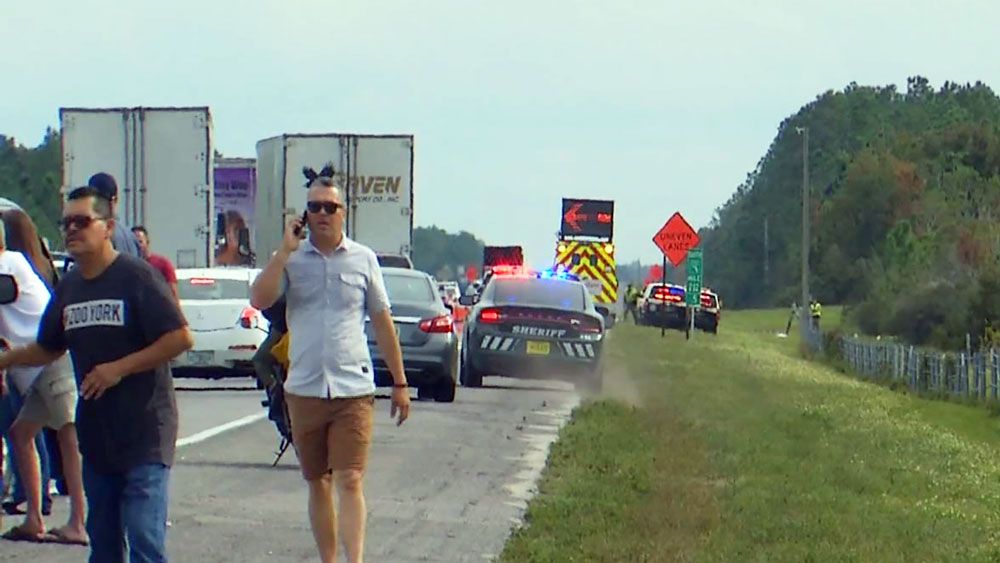 A long line of stopped vehicles on Florida's Turnpike after a fatal rollover crash. (Spectrum News)