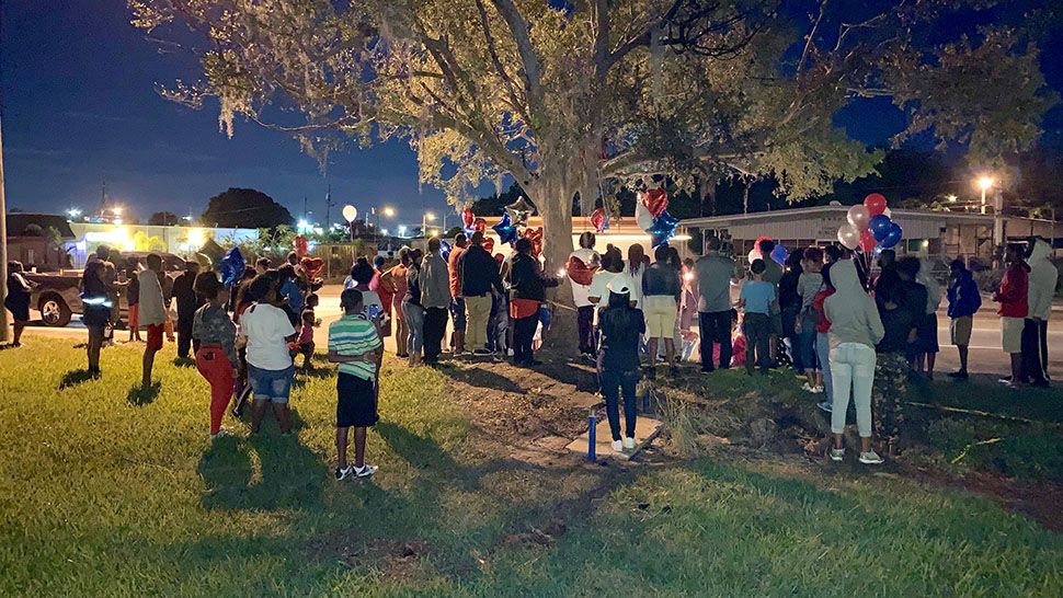 Family and friends held a vigil for the two teens who were killed in a crash in St. Petersburg on Monday. (Saundra Weathers/Spectrum News 9)