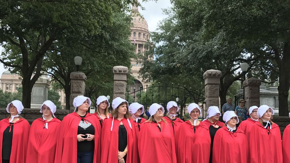 Protesters with the National Association for the Repeal of Abortion Laws Texas dressed as characters from the “Handmaid's Tale” speak out against anti-abortion legislation in March of 2017. Courtesy/Max Gorden