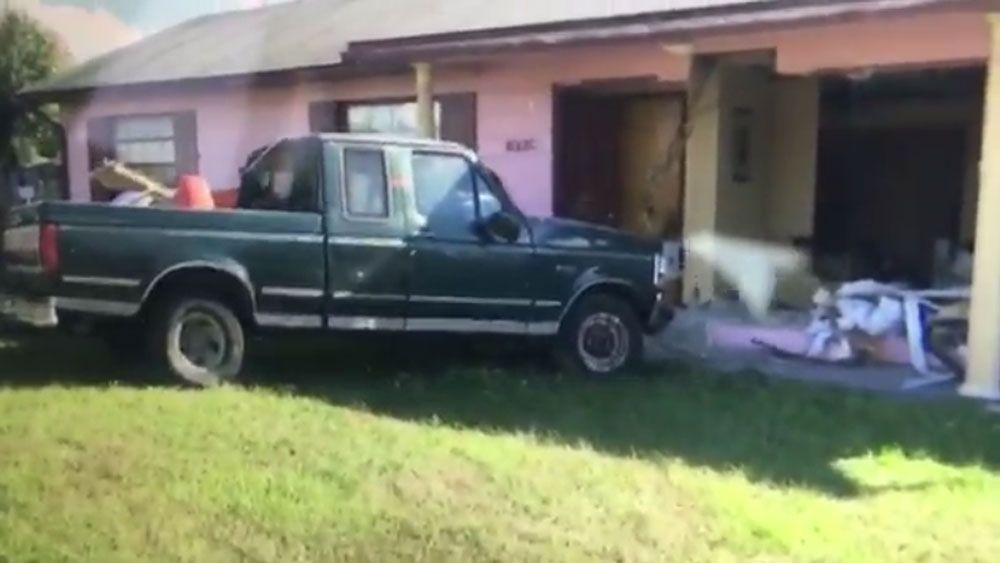A pickup truck crashed into a home in the Pine Hills area of Orange County Friday. (Spectrum News)