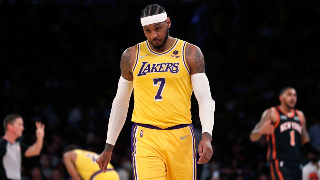 Los Angeles Lakers forward Carmelo Anthony walks on the court during the second half of the team's NBA basketball game against the New York Knicks on Tuesday, Nov. 23, 2021, in New York. (AP Photo/Jim McIsaac)