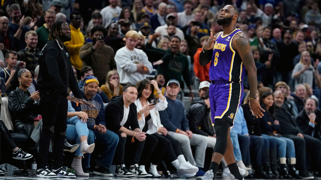 Los Angeles Lakers' LeBron James reacts after hitting a shot during overtime of the team's NBA basketball game against the Indiana Pacers, Wednesday, Nov. 24, 2021, in Indianapolis. (AP Photo/Darron Cummings)