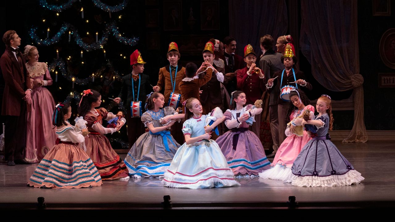 This image released by the New York City Ballet shows Athena Shevorykin, center, as Marie in "The Nutcracker," on Nov. 26, 2021, in New York