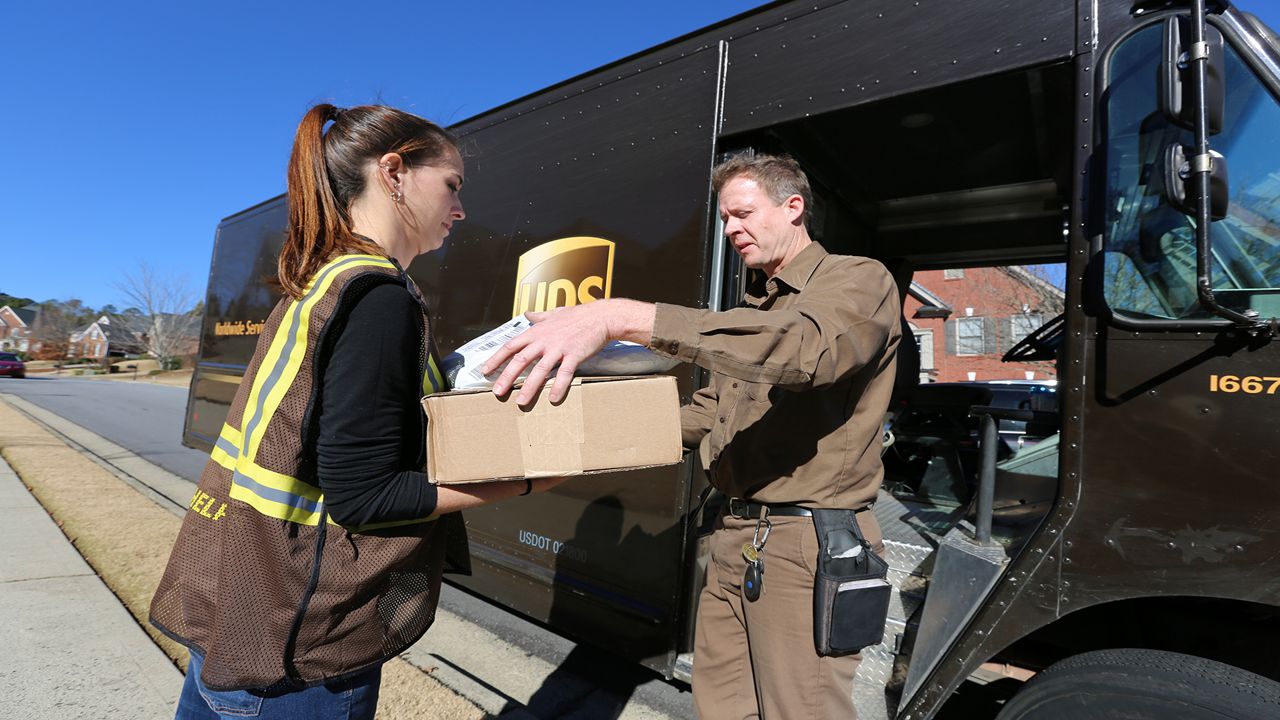 A UPS package is handed off in this file image. (Spectrum News/FILE)