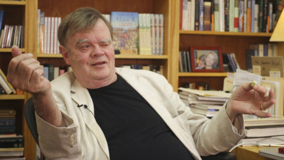 Garrison Keillor, creator and former host of, "A Prairie Home Companion," talks at his St. Paul, Minn., office. Keillor said Wednesday, Nov. 29, he's been fired by Minnesota Public Radio over allegations of improper behavior. (AP Photo/Jeff Baenen, File)