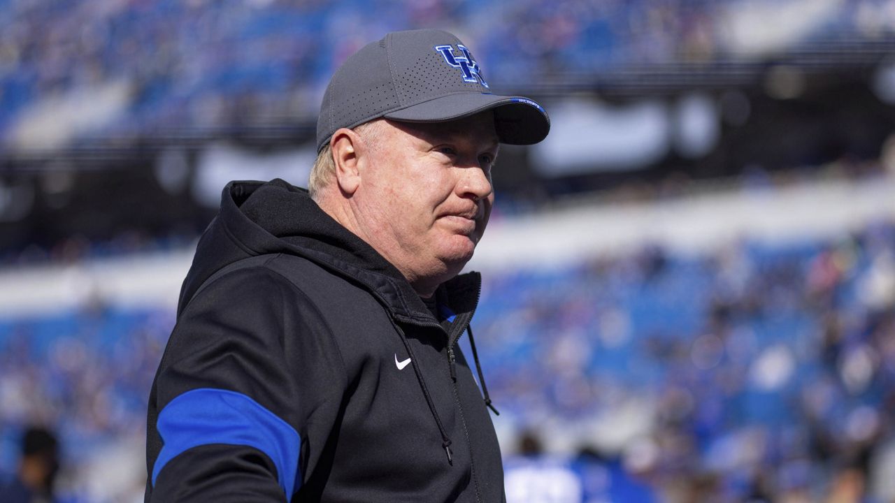 Kentucky head coach Mark Stoops waits for his senior players to come out during Kentucky's senior day celebration before an NCAA college football game against New Mexico State in Lexington, Ky., Saturday, Nov. 20, 2021. (AP Photo/Michael Clubb)