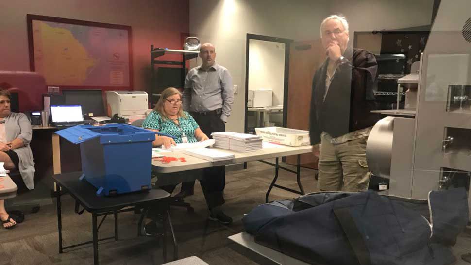 Manatee County elections officials watch as machine conduct the statewide recount of ballots cast in the 2018 General Election.