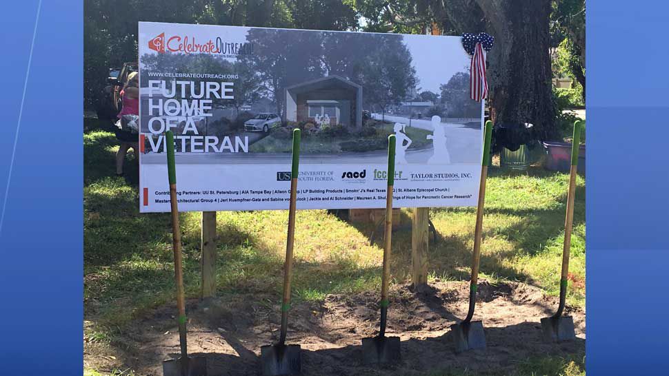 Celebrate Outreach sign showing future "tiny home" along with ceremonial shovels where the group broke ground Monday on a future home for a homeless veteran. (Dalia Dangerfield/Spectrum Bay News 9)