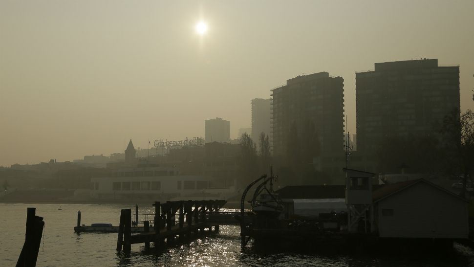 Aquatic Park and Ghirardelli Square in the background is obscured by smoke and haze from wildfires Friday, Nov. 16, 2018, in San Francisco. (AP Photo/Eric Risberg)