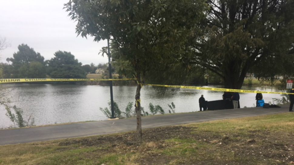 Crime scene tape around Woodlawn Lake Park where a body was found. (Spectrum News footage)