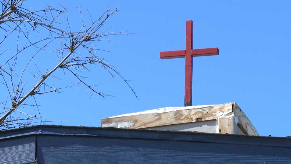 Cross above Holy Ground Homeless Shelter in Hudson.