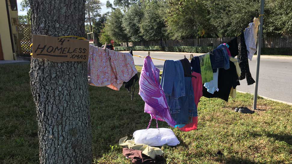 Bright H.O.P.E.S. Pasco set up this donation clotheline near a Walmart parking lot on U.S. 19 in Port Richey. Anyone is welcome to take an item of clothing from the clothesline for free. (Sarah Blazonis/Spectrum Bay News 9)