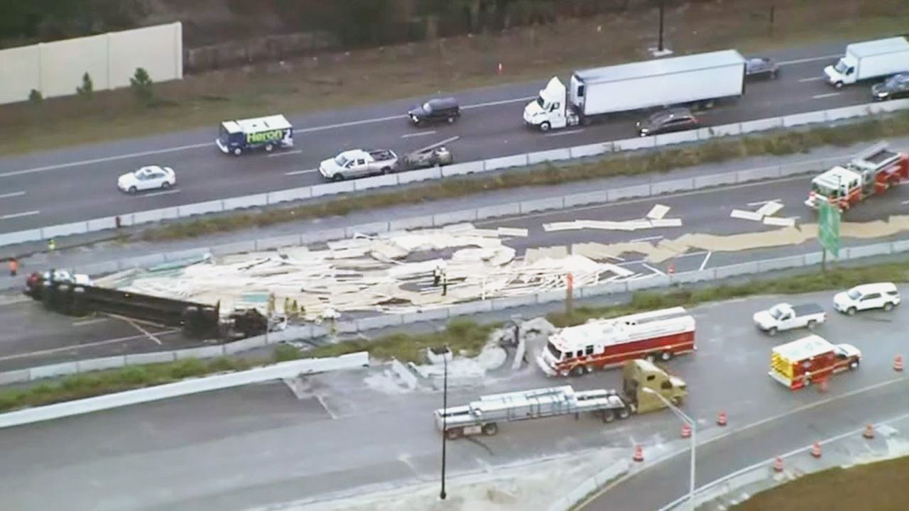The semi spilled its cargo, which blocked the Interstate 4 westbound lanes. (Sky 13)