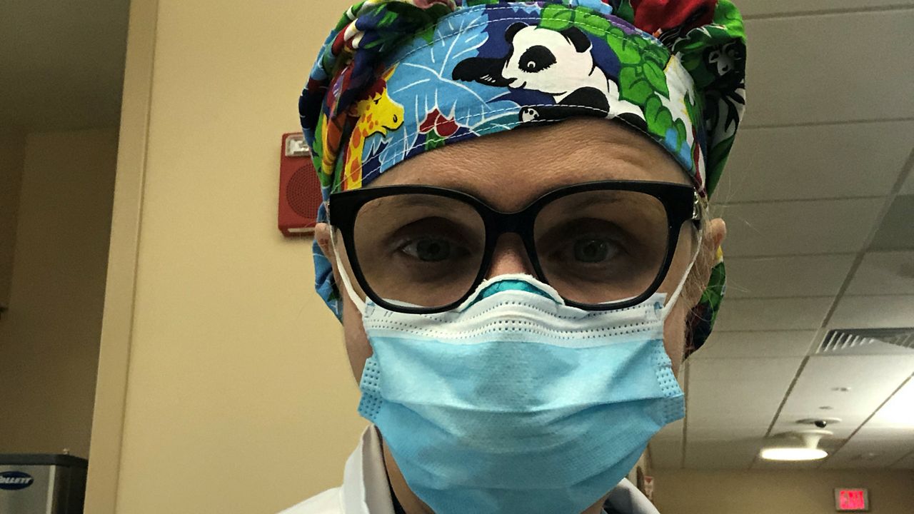 Dr. Azra Bihorac demonstrates the full PPE she wears to work everyday. (Photo courtesy of Dr. Azra Bihorac)