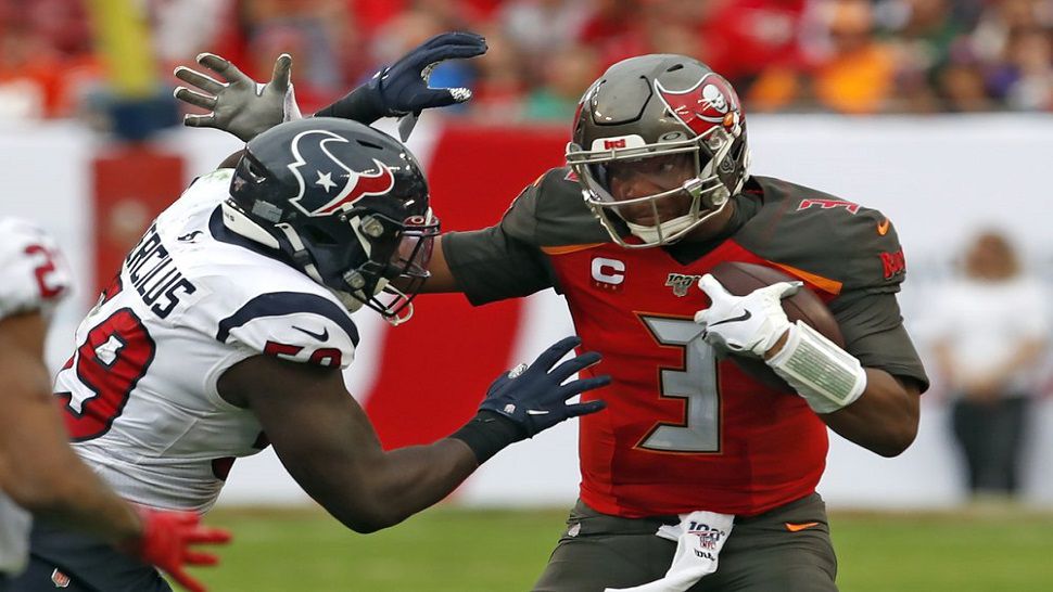 Tampa Bay quarterback Jameis Winston is sacked by Texans linebacker Whitney Mercilus in the second half of the Bucs' 23-20 loss to Houston.  Winston threw four interceptions today and now has a league-high 28 this season.  (AP Photo/Mark LoMoglio)