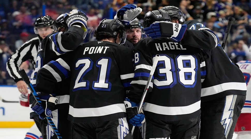 Tampa Bay Lightning center Brayden Point (21) celebrates after his goal against the New York Rangers with teammates during the second period of an NHL hockey game Saturday, Dec. 28, 2024, in Tampa, Fla. (AP Photo/Chris O'Meara)