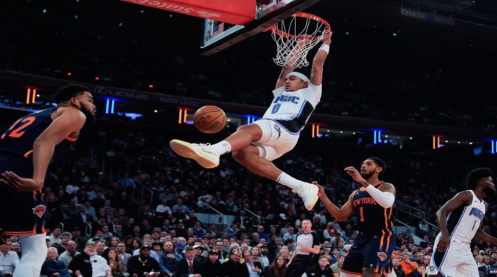 Orlando Magic guard Anthony Black (0) dunks during the first half of an NBA Cup basketball game against the New York Knicks, Tuesday, Dec. 3, 2024, in New York, N.Y. (AP Photo/Julia Demaree Nikhinson)