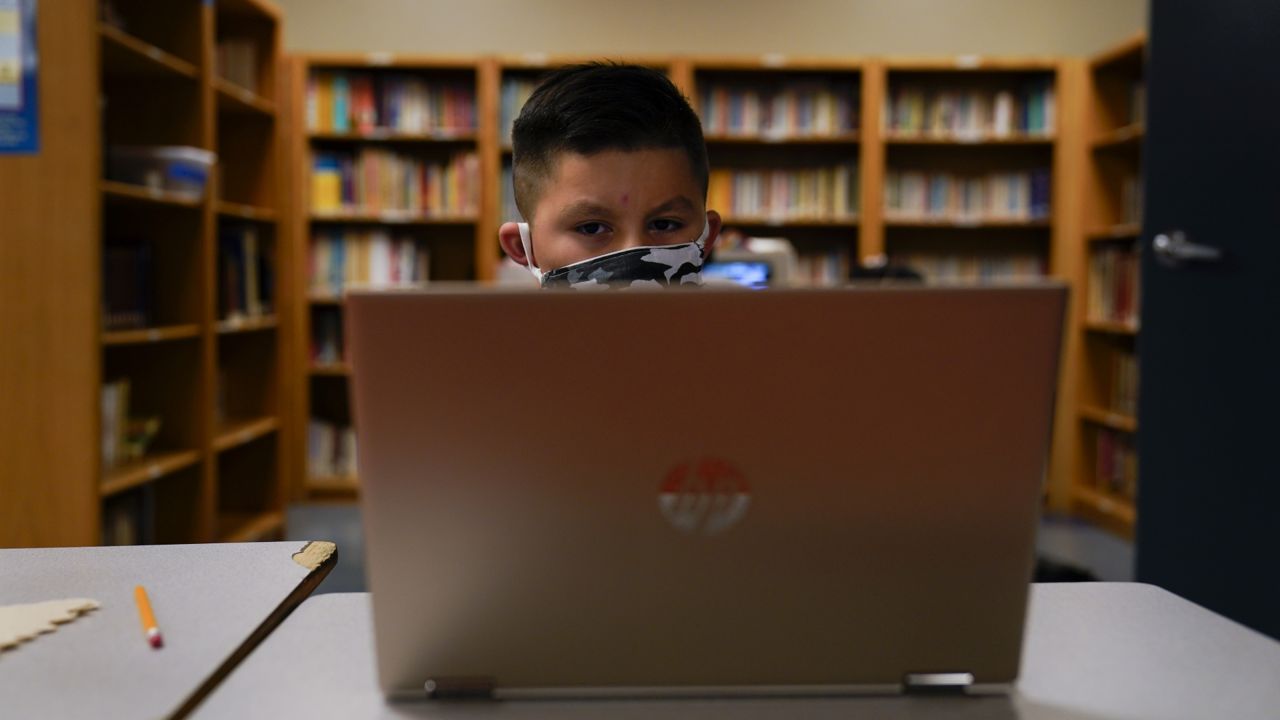 A Los Angeles Unified School District student attends an online class at Boys & Girls Club of Hollywood in Los Angeles, Wednesday, Aug. 26, 2020. (AP Photo/Jae C. Hong)
