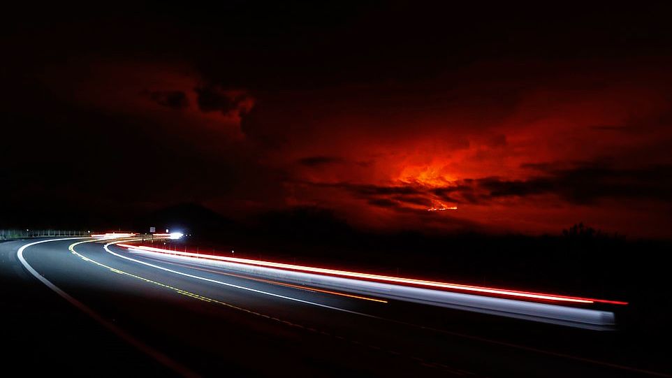 Lava continued to creep slowly in the direction of Daniel K. Inouye Highway on Wednesday. (Associated Press)