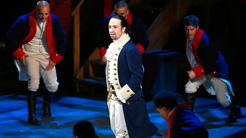 In this June 12, 2016 file photo, Lin-Manuel Miranda and the cast of "Hamilton" perform at the Tony Awards in New York. (Photo by Evan Agostini/Invision/AP, File)