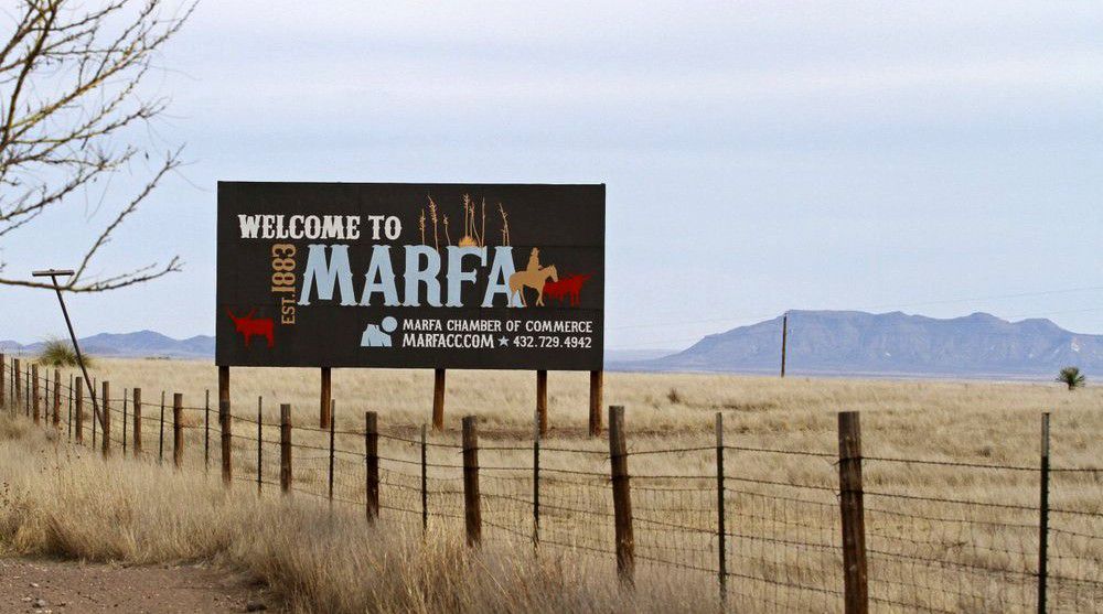 In this March 7, 2019 photo, a welcome to Marfa sign is posted off of Highway 90. (Jacob Ford/Odessa American via AP)