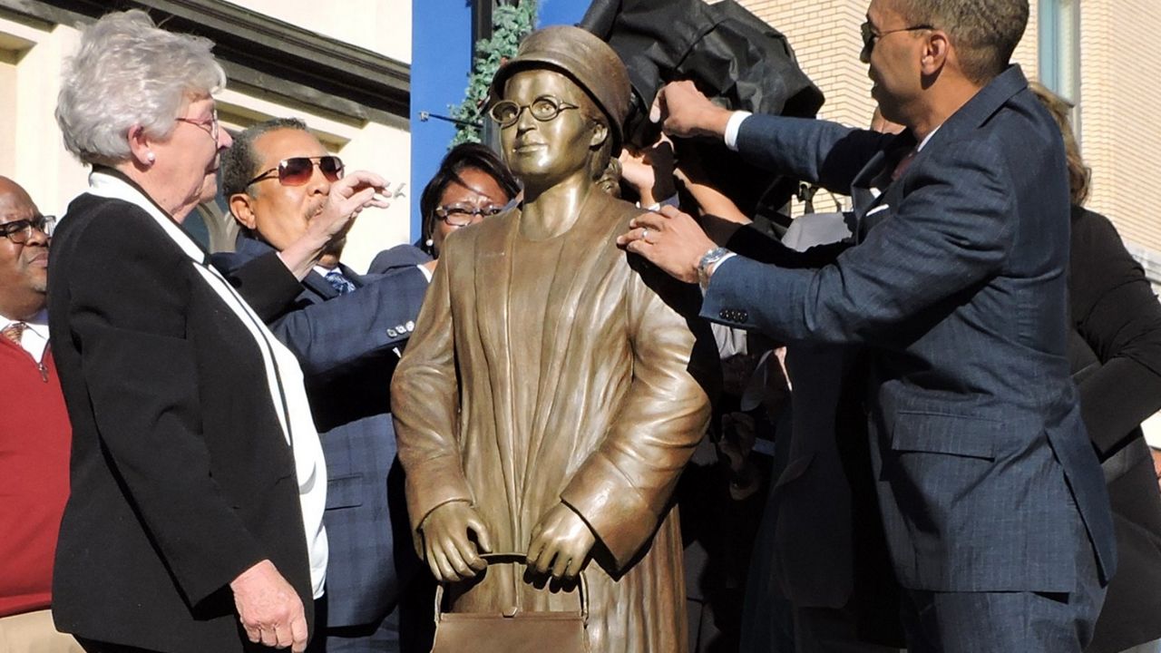 The newly unveiled statue of Rosa Parks, which stands feet away from where she is thought to have boarded that faithful bus 64 years ago. 