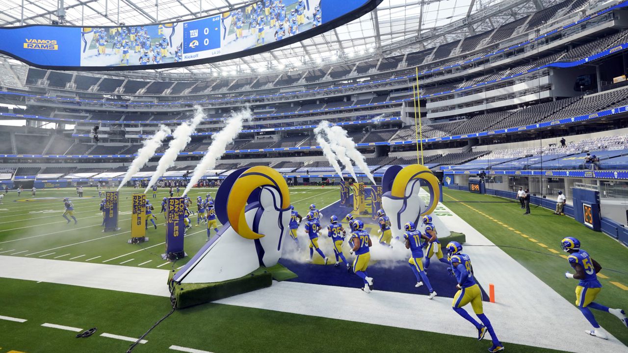 The Los Angeles Rams enter the field before an NFL football game against the New York Giants Sunday, Oct. 4, 2020, in Inglewood, Calif. (AP Photo/Ashley Landis )