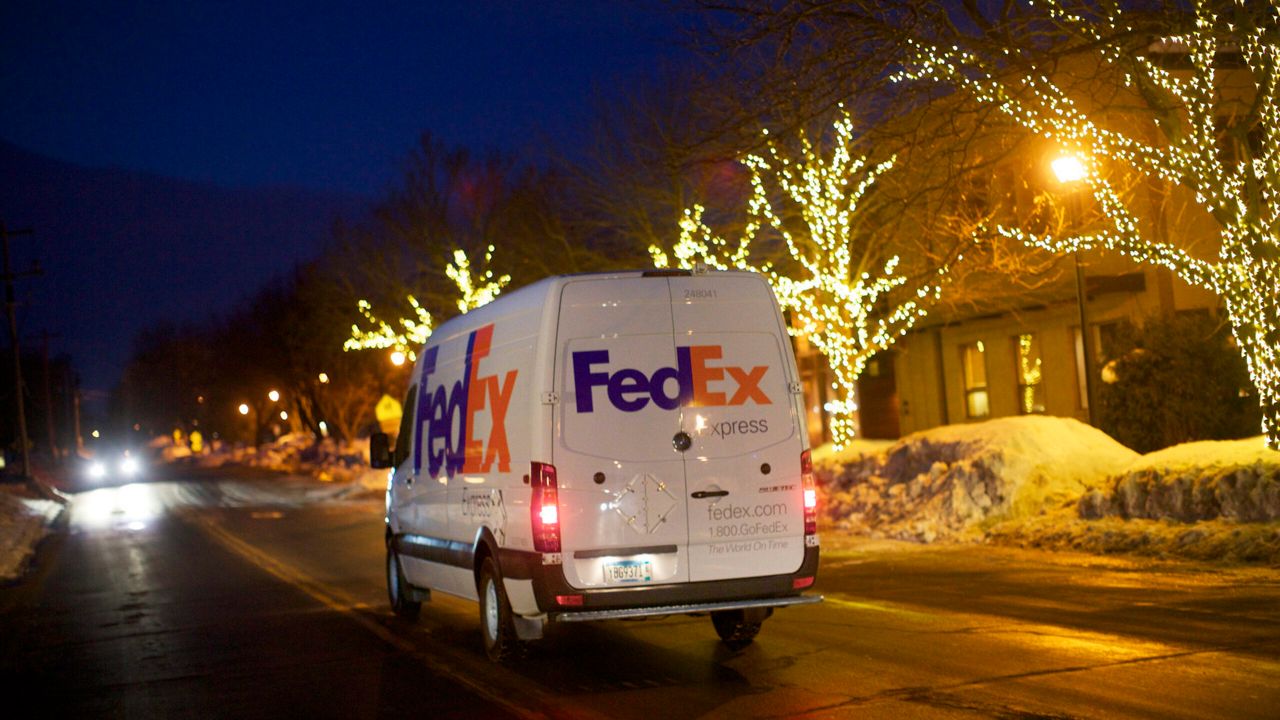 fedex truck driving in snow