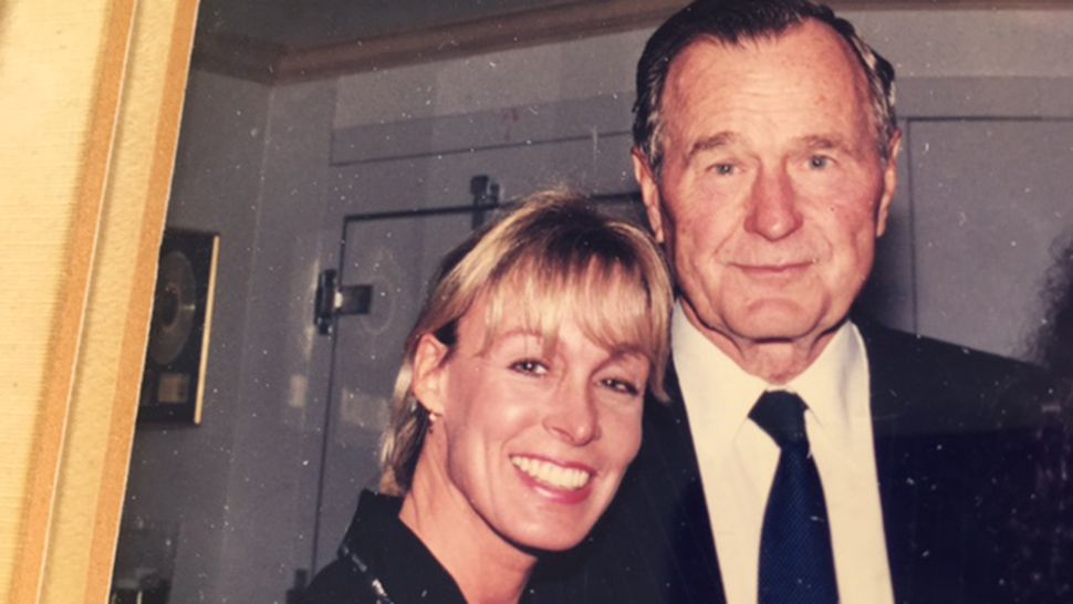 Scoti Lucas, left, pictured with George H.W. Bush during a visit to Orlando in 1999. (Jeff Allen/Spectrum News 13)