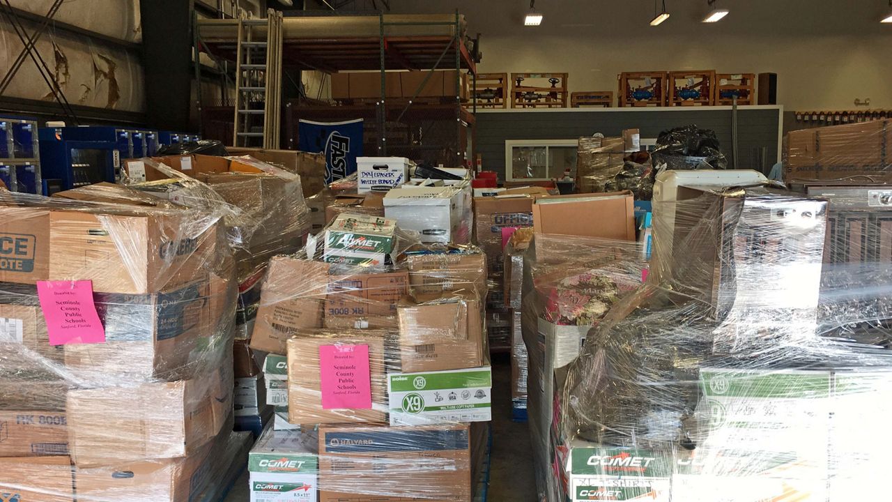 At a Seminole County warehouse, 38 pallets are stacked high with a trove of supplies ready to head to Northwest Florida. (Asher Wildman/Spectrum News)